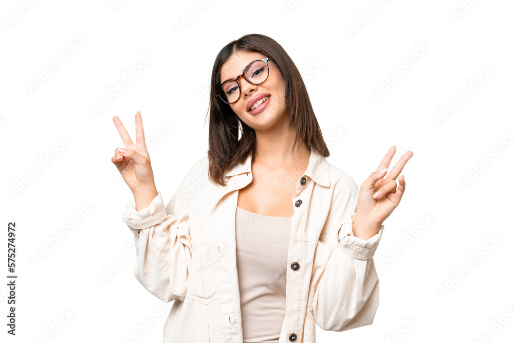 Young Russian woman over isolated chroma key background showing victory sign with both hands Young Russian woman over isolated chroma key background showing victory sign with both hands