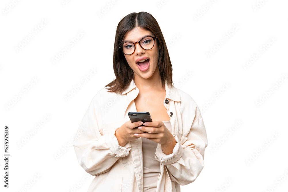 Young Russian woman over isolated chroma key background surprised and sending a message Young Russian woman over isolated chroma key background surprised and sending a message