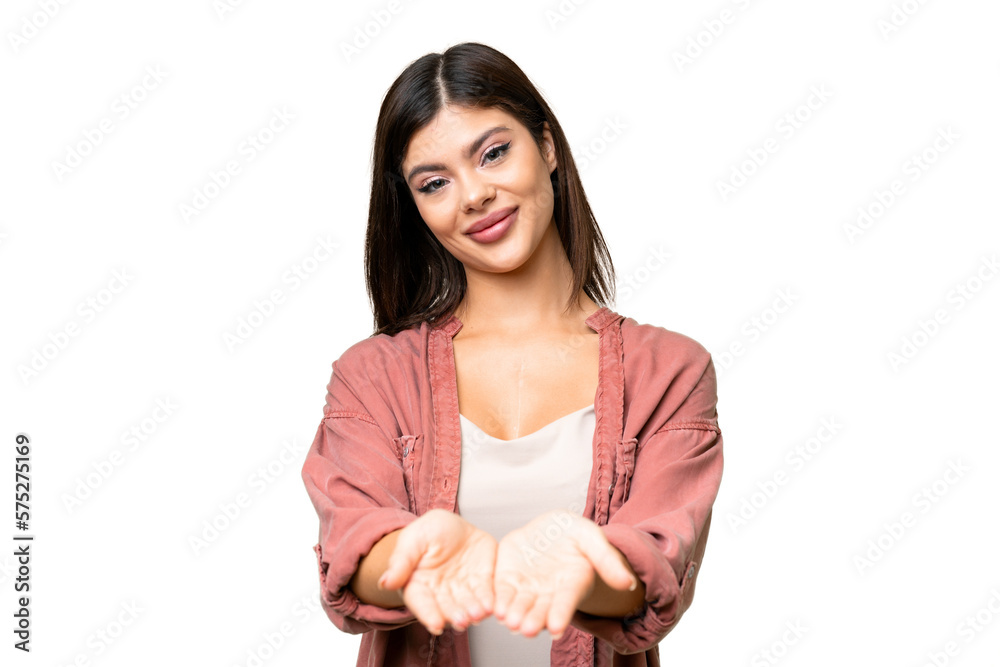 Young Russian woman over isolated chroma key background holding copyspace imaginary on the palm to insert an ad Young Russian woman over isolated chroma key background holding copyspace imaginary on the palm to insert an ad