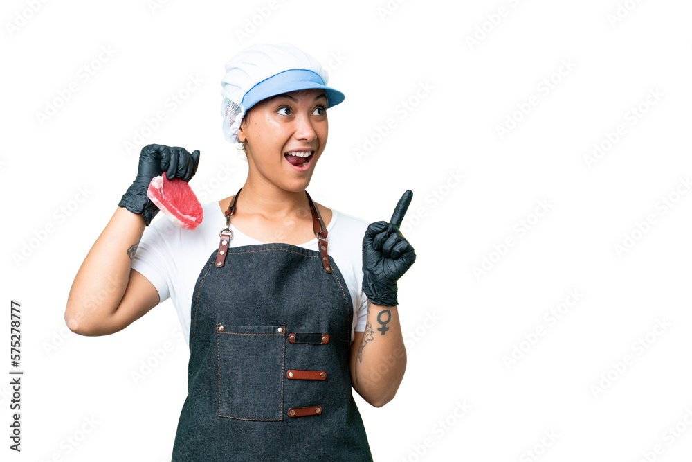 Butcher woman wearing an apron and serving fresh cut meat over isolated chroma key background intending to realizes the solution while lifting a finger up Butcher woman wearing an apron and serving fresh cut meat over isolated chroma key background intending to realizes the solution while lifting a finger up