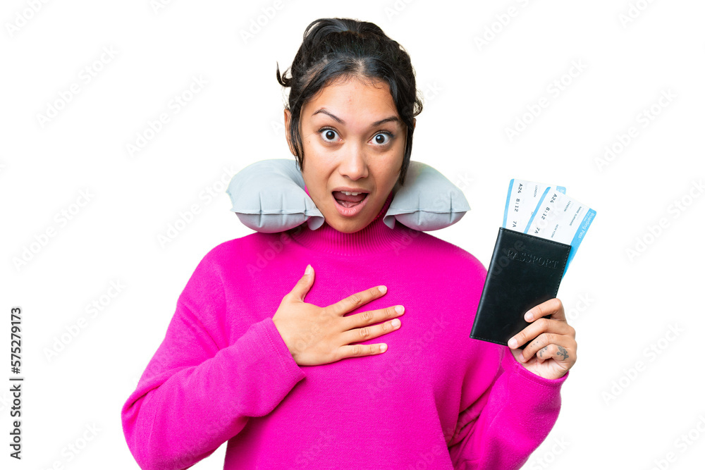 Young Uruguayan woman holding a passport over isolated chroma key background surprised and shocked while looking right Young Uruguayan woman holding a passport over isolated chroma key background surprised and shocked while looking right