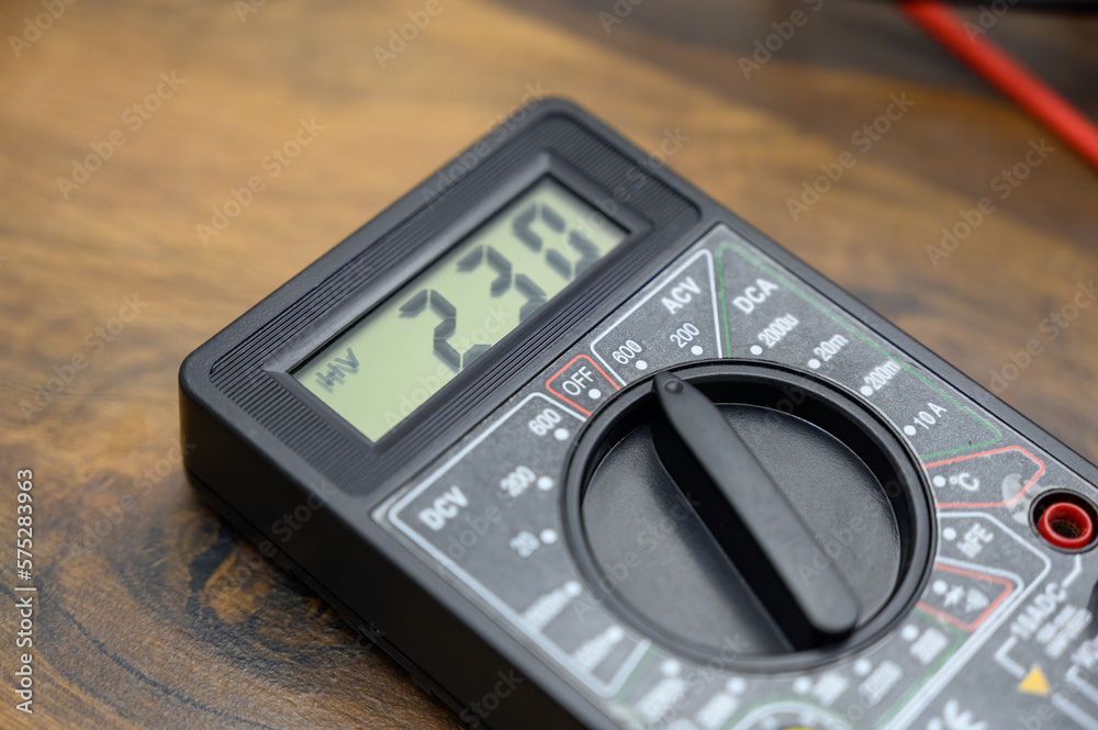 close-up of the screen testing a multimeter during a test of current strength during home renovation. close-up of the screen testing a multimeter during a test of current strength during home renovation.