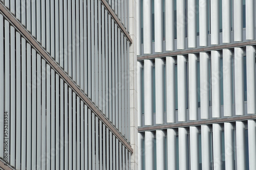Part of the facade of two buildings to cover, with parallel horizontal and vertical lines, uneven