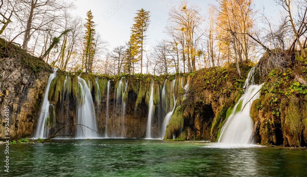 Plitvice Lakes National Park during colorful autumn, Croatia, Europe. Fall colors leafs on trees. Waterfalls and water in sunny morning light with fog. Landscape photography. View of Plitvicka Jezera. Plitvice Lakes National Park during colorful autumn, Croatia, Europe. Fall colors leafs on trees. Waterfalls and water in sunny morning light with fog. Landscape photography. View of Plitvicka Jezera.