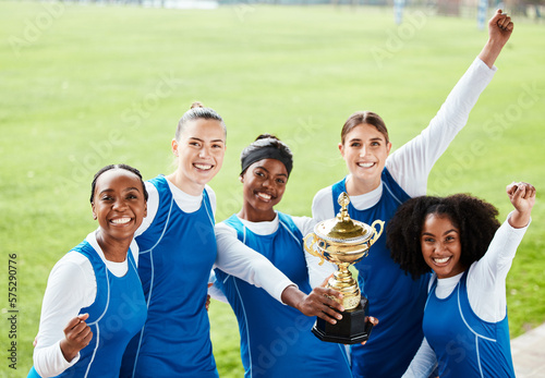 Women, friends and celebration for winning, trophy or sports team on grass field in the outdoors. Happy sporty woman group smiling in sport teamwork celebrating win, victory or achievement together