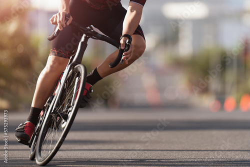 Fototapeta Naklejka Na Ścianę i Meble -  Road bike cyclist man cycling, athlete on a race cycle. Leaning into a corner	