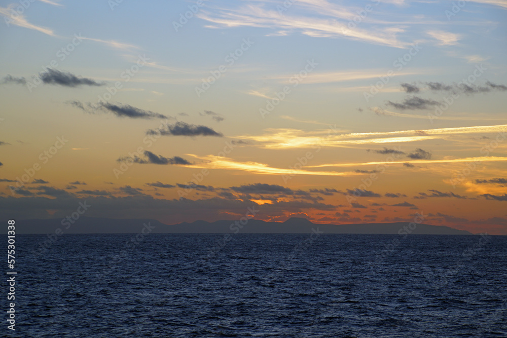 Magic of the Atlantic. Sunrise . Open ocean waves horizon and clouds. Bright colors.	