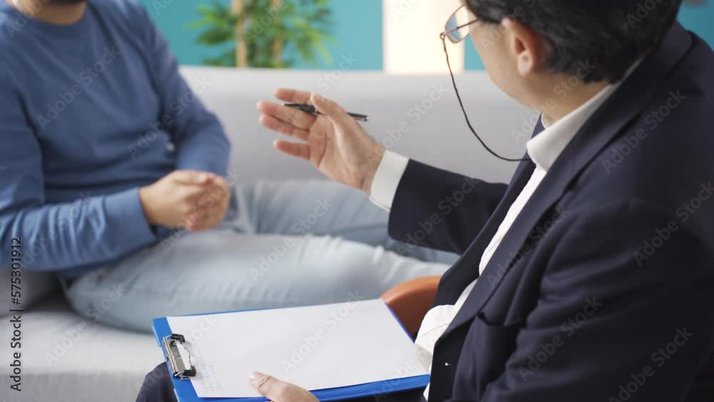 Psychologist asking questions to his patient with psychological
