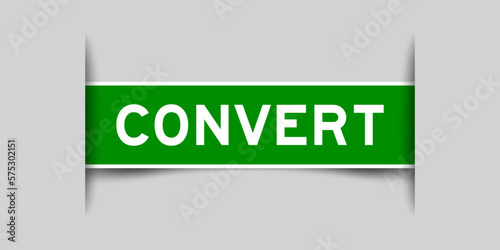 Green color square label sticker with word convert that inserted in gray background