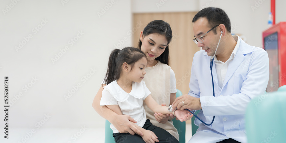 Fototapeta premium The pediatrician examined the health of the girl