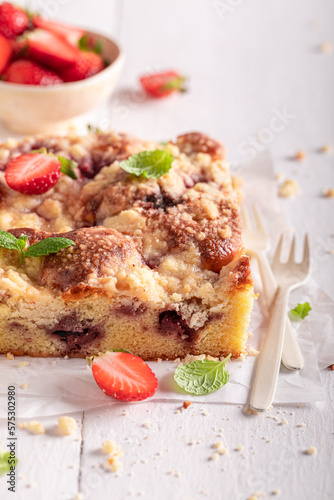 Sweet and homemade strawberry cake with fresh fruits and sugar.