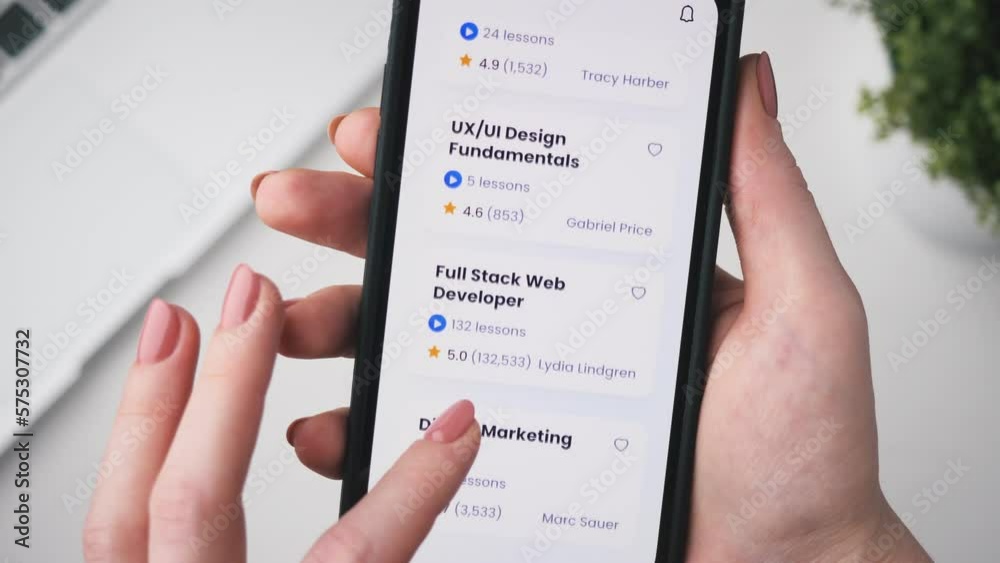 Woman enrolling into an coding online course. Checking full stack web development online course using app for mobile phone.