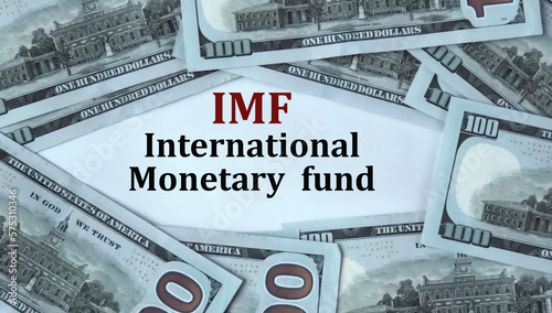 IMF - acronym on the background of cash dollar bills photo