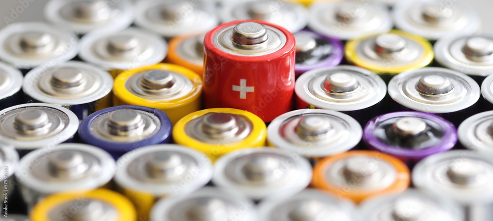 many round batteries and one red battery many round batteries and one red battery