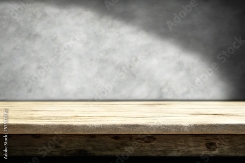 Wood table counter with concrete grunge texture background 