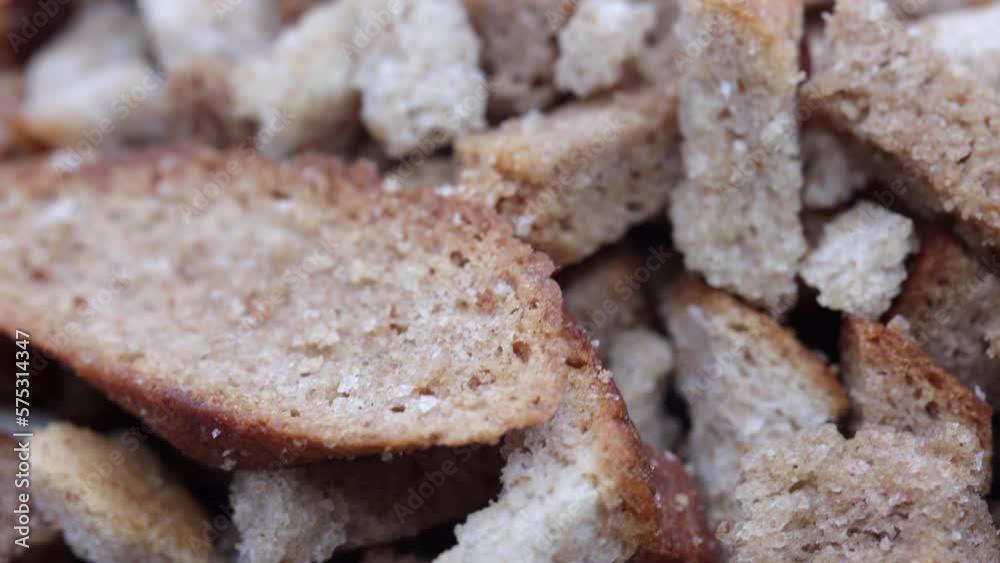 Rye Crackers In A Black Plate. Bread Crispy Crackers. Breadcrumbs. Close Up. Top View. Close Up. 4k, 60 FPS, ProRes Rye Crackers In A Black Plate. Bread Crispy Crackers. Breadcrumbs. Close Up. Top View. Close Up. 4k, 60 FPS, ProRes