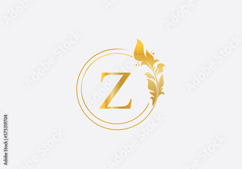 Golden leaf and circle logo design. Golden beauty and business symbol and alphabets design
