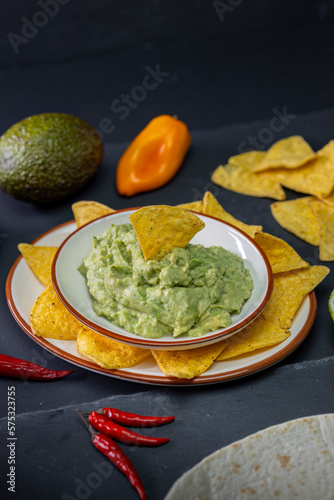 stilll life of guacamole with nachos