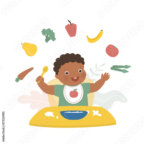 Happy african american infant boy eating proper nutrition. Food containing many useful vitamins, nutrition for growing organism. Plate of porridge with fruits and vegetables.