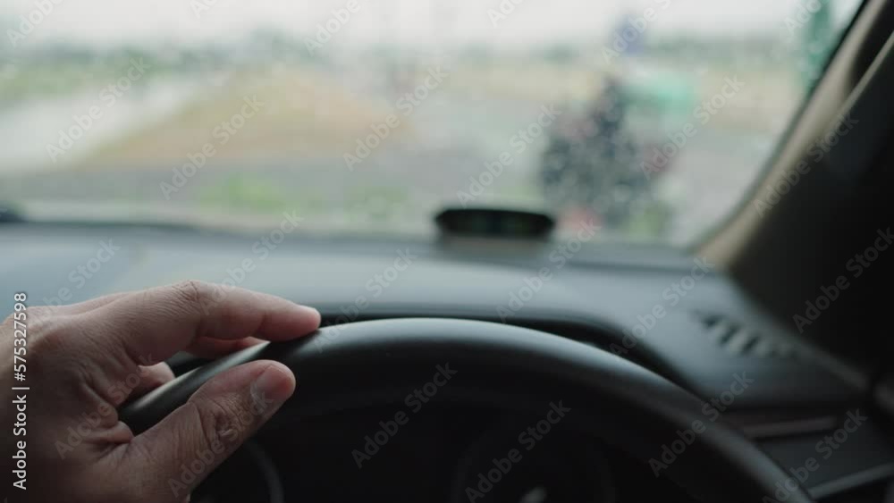 Man driver being impatient, waiting inside his car and showing signs of frustration. Man driver being impatient, waiting inside his car and showing signs of frustration.