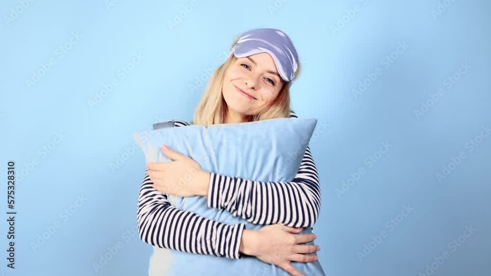 Portrait of pretty relaxed young woman with sleep mask hug pillow and want to stay in sweetly bed all day on isolated blue background Sweet dream Lazy day Weekend Portrait of pretty relaxed young woman with sleep mask hug pillow and want to stay in sweetly bed all day on isolated blue background Sweet dream Lazy day Weekend