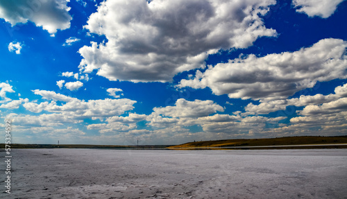 Kuyalnitsky estuary - a salt desert on the site of a drying pond, white thunderclouds before the rain. Ecological problem of the south of Ukraine