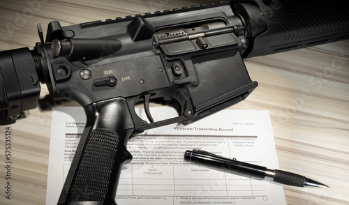 Assault rifle with public domain FBI Background check form photo