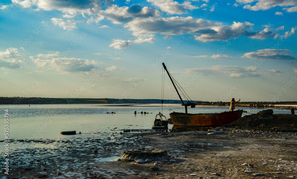 Old iron boat for the extraction of therapeutic mud on the Kuyalnitsky estuary, Ukraine Old iron boat for the extraction of therapeutic mud on the Kuyalnitsky estuary, Ukraine