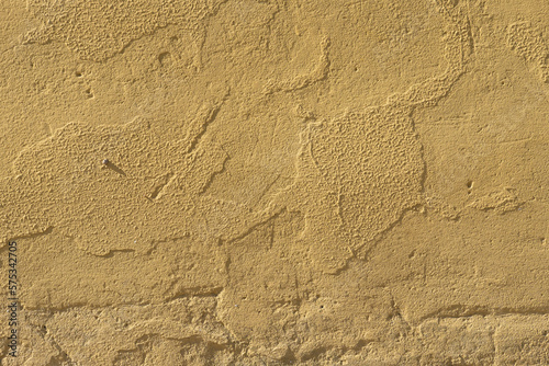 Yellow cement textured wall for backgrounds.