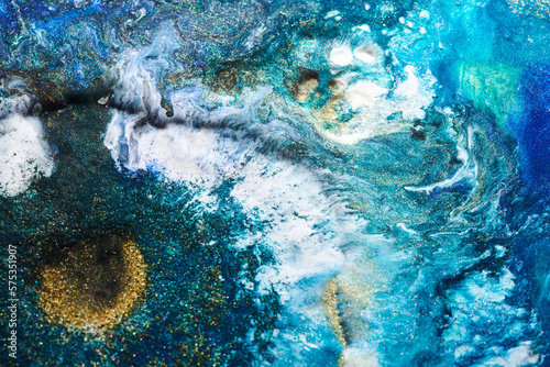 Luxury abstract background, liquid art. Blue alcohol ink with golden paint streaks, water surface, marble texture