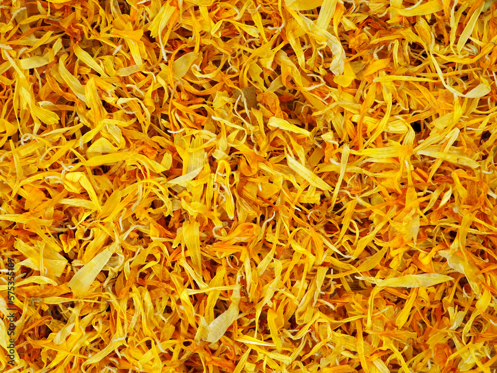 Dried marigold or calendula petals as background. Dried marigold or calendula petals as background.
