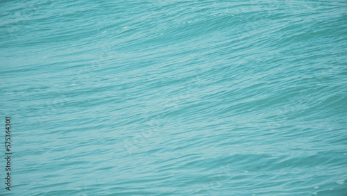 Blue background texture of the sea water. The surface of the sea.