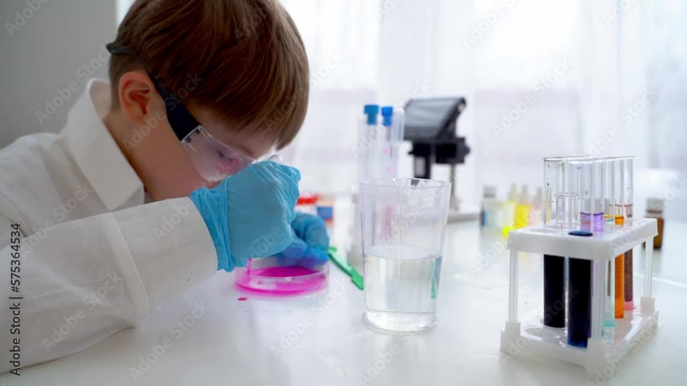 Children perform chemical experiments with a white liquid Children perform chemical experiments with a white liquid