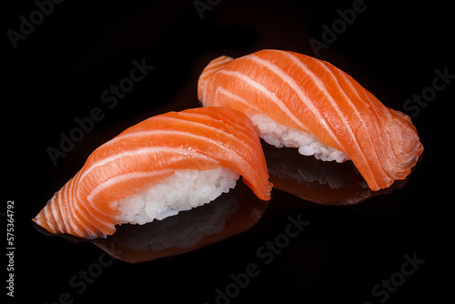 classic sushi with salmon on a black background 