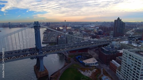 Wallpaper Mural Aerial Panning Shot Of Vehicles Moving On Brooklyn Bridge Amidst Modern Buildings In City During Sunset - New York, New York Torontodigital.ca