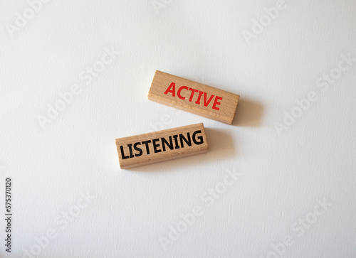 Active listening symbol. Wooden blocks with words Active listening. Beautiful white background. Business and Active listening concept. Copy space.