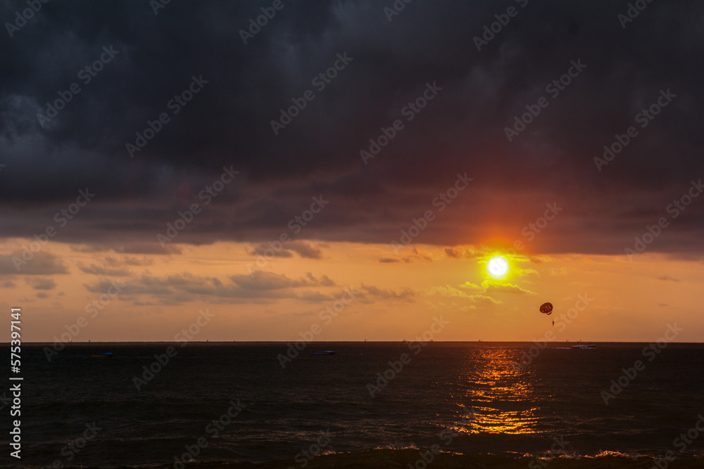 Sunset beach paragliding