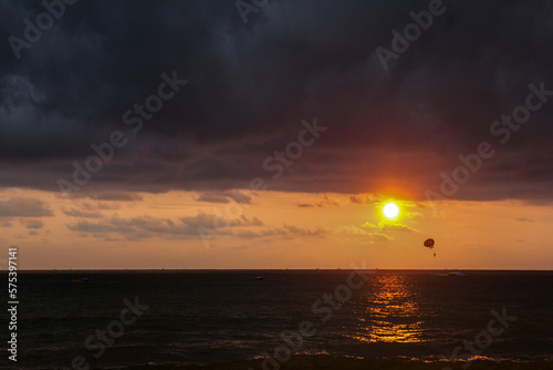 Sunset beach paragliding