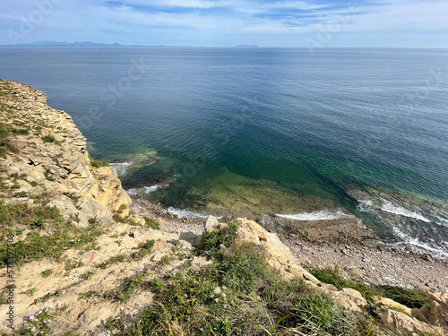 The seabed through the clear water off the coast of the Russian island. Akhlestysheva Bay