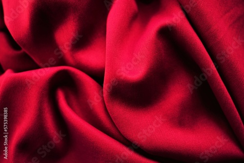 Vivid red crumpled elastic fabric background