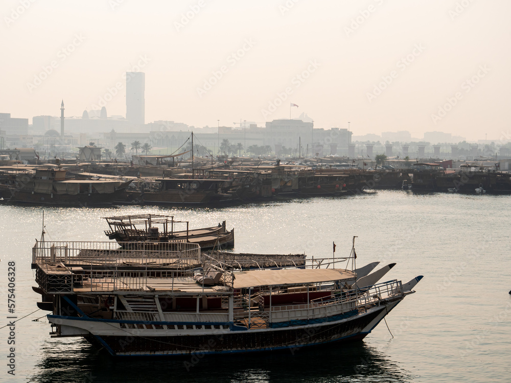 Misty view of boats in the bay in the city of Doha, capital of Qatar
