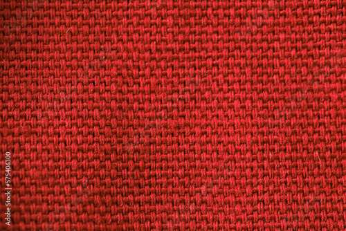 A red fabric with a black and red pattern.