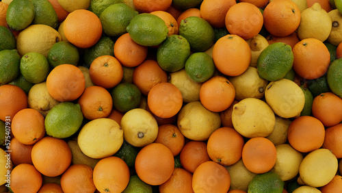 3D render of citrus fruits, oranges and lemons, limes background