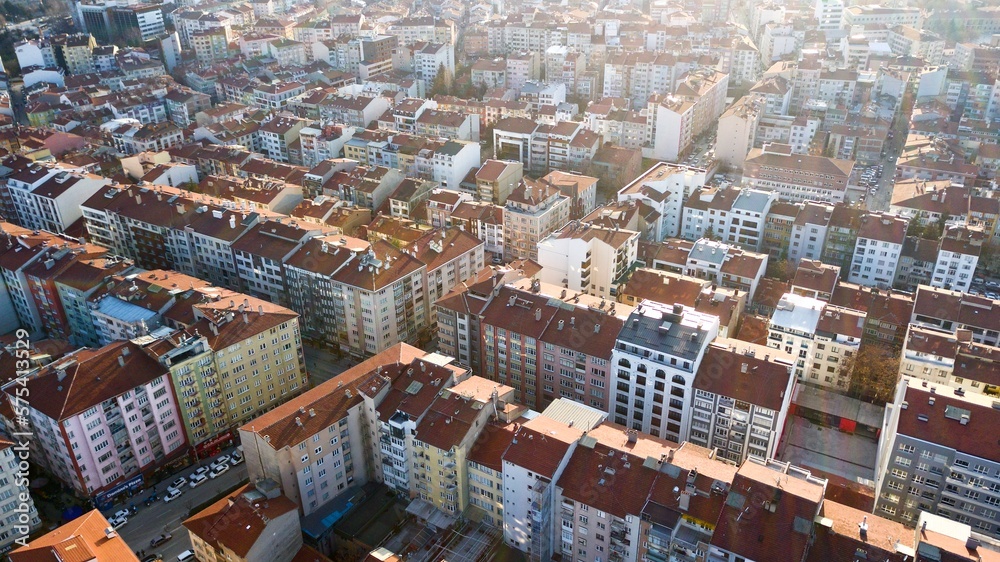 Aerial view of the city buildings at sunset