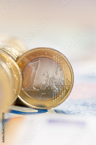 One Euro coin money saving pay paying finances with copyspace copy space portrait format