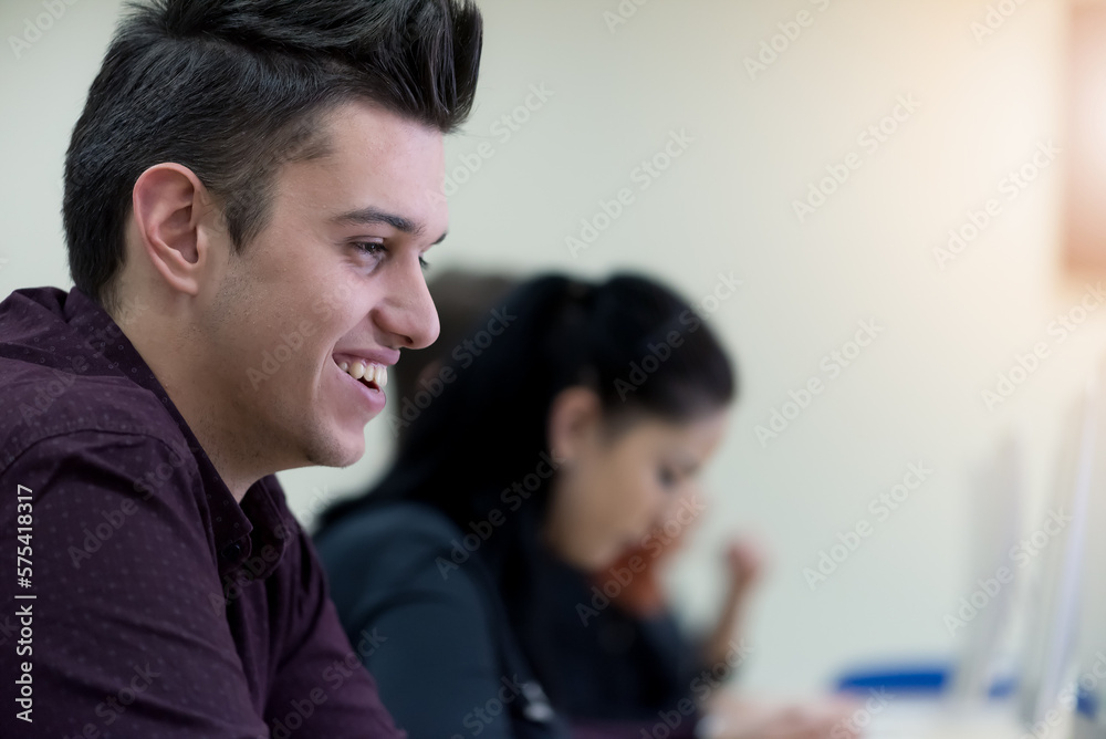 Young people in programming school.Students Learning In A Programing Class Young people in programming school.Students Learning In A Programing Class