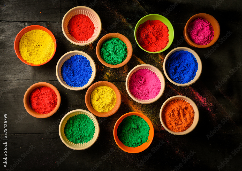 Colorful traditional holi powder in bowls. Happy holi. Concept