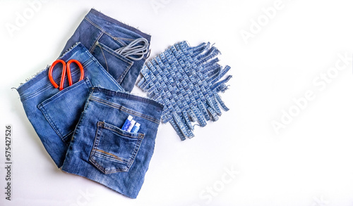 Old jeans ready to upcycling. Concept of things reuse and natural resources preserving.	