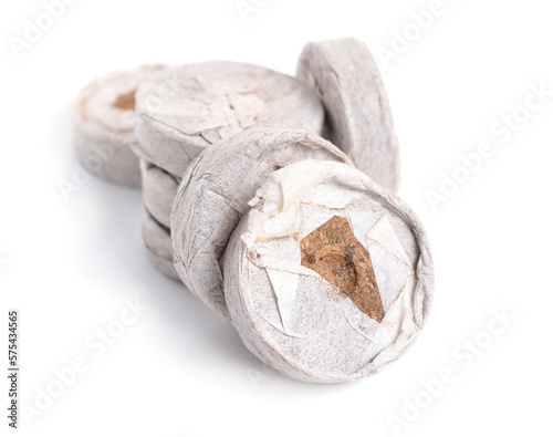Peat tablets or briquettes for sprouts. Isolated on white background
