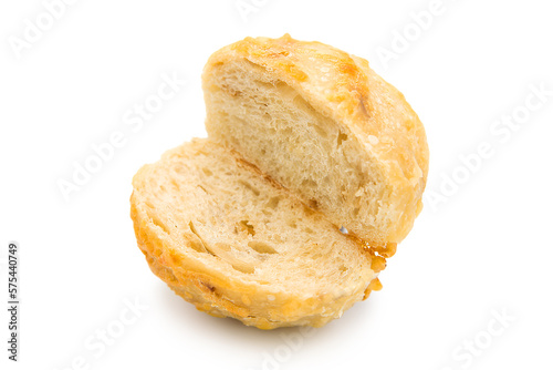 Freshly baked cheese bun cut in half isolated on white background.